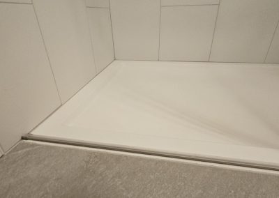 curb-less stone shower pan